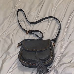 gray purse with gold stones around it